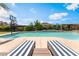 Relaxing backyard pool with sun loungers and desert landscaping perfect for Gathering outdoor fun at 9385 Mohawk St, Las Vegas, NV 89139