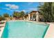 Inviting backyard pool with a Baja shelf and rock waterfall feature for an elegant outdoor lifestyle at 9385 Mohawk St, Las Vegas, NV 89139