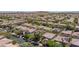 This aerial shows a planned community with numerous homes and mature landscaping at 9814 Gifthouse St, Las Vegas, NV 89178