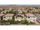 A view of the house shows its relation to other houses in the neighborhood at 9814 Gifthouse St, Las Vegas, NV 89178