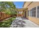 Patio and backyard with a covered patio and nicely landscaped area at 9814 Gifthouse St, Las Vegas, NV 89178