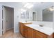 Bathroom features double sinks, a large mirror, and tiled flooring at 9814 Gifthouse St, Las Vegas, NV 89178