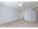 Spacious carpeted bedroom features a ceiling fan and a closet with sliding doors at 9814 Gifthouse St, Las Vegas, NV 89178