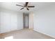 This spacious bedroom features a ceiling fan, carpet flooring, and closet space, ready for personalization at 9814 Gifthouse St, Las Vegas, NV 89178