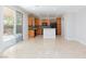 Open-concept kitchen boasts wooden cabinets and modern appliances, perfect for entertaining at 9814 Gifthouse St, Las Vegas, NV 89178