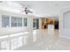 Open-concept living area with tile flooring and abundant natural light at 9814 Gifthouse St, Las Vegas, NV 89178