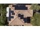 A close aerial view shows solar panels mounted on the terracotta roof at 9814 Gifthouse St, Las Vegas, NV 89178
