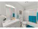 Well-lit bathroom features a modern vanity, framed mirror, and bathtub with glass sliding doors at , Las Vegas, NV 89101