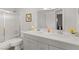 Bathroom featuring double sinks, gray cabinetry, and a shower with glass doors at , Las Vegas, NV 89101
