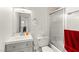 Bright bathroom features a vanity with grey cabinets and shower with sliding glass door at , Las Vegas, NV 89101