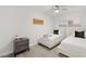Bedroom featuring two beds, wood-look flooring, a ceiling fan, and a window at , Las Vegas, NV 89101