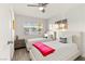 Bedroom with two twin beds, a ceiling fan, and a large window for natural light at , Las Vegas, NV 89101