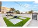Modern courtyard with turf squares, gazebo, seating area, and privacy fence for outdoor enjoyment at , Las Vegas, NV 89101