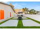 Modern courtyard with turf squares, gazebo, seating area, and colorful exterior doors at , Las Vegas, NV 89101