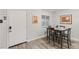 Dining area with wood-look flooring and modern furniture with a front door at , Las Vegas, NV 89101