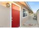 Inviting exterior with bright red door, modern light fixture, and well maintained walkway at , Las Vegas, NV 89101