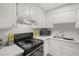 Well-equipped kitchen with white cabinetry, modern appliances, and sleek countertops at , Las Vegas, NV 89101