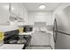 Well-equipped kitchen with white cabinetry, modern appliances, and sleek countertops at , Las Vegas, NV 89101