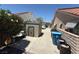 Backyard shed and sidewalk alongside a block wall; a driveway can be seen in the background at , Las Vegas, NV 89145