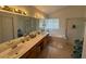 Bright bathroom with double sinks, a soaking tub, a separate shower, and ample natural light at , Las Vegas, NV 89145