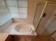 Bright bathroom featuring bathtub and separate glass-enclosed shower at , Las Vegas, NV 89145