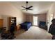 Spacious bedroom featuring a ceiling fan, a door to the outside, and a neutral color scheme at , Las Vegas, NV 89145