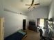 Bedroom features a ceiling fan, desk, and comfortable bed at , Las Vegas, NV 89145
