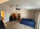 Bedroom features a ceiling fan, desk, and comfortable bed at , Las Vegas, NV 89145