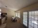 Cozy dining area with a table set for four, a kitchen bar, and access to the backyard at , Las Vegas, NV 89145