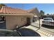 View of side yard with metal fence and tile roof at , Las Vegas, NV 89145