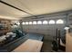 Cluttered garage with a covered pool table and an open door at , Las Vegas, NV 89145