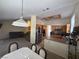 Open-concept living room and kitchen area with a view of stainless steel appliances and granite countertops at , Las Vegas, NV 89145