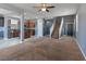 Open concept living space showcasing a seamless flow between the living area, kitchen, and staircase at 1012 Water Cove St, Henderson, NV 89011