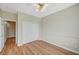 Inviting bedroom features a ceiling fan, wood-look floors, and a closet with double doors at 10198 Timber Willow Ave, Las Vegas, NV 89135