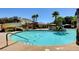 Community pool featuring a waterslide, nearby seating, and easy access at 10198 Timber Willow Ave, Las Vegas, NV 89135
