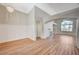 Bright, open living room with beautiful wood flooring, a fireplace, and modern lighting fixtures at 10198 Timber Willow Ave, Las Vegas, NV 89135