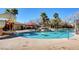Community pool with a water slide and comfortable lounge areas, ideal for relaxation at 10198 Timber Willow Ave, Las Vegas, NV 89135