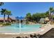 Relaxing community pool with a splash fountain and water slide, perfect for Gathering fun at 10198 Timber Willow Ave, Las Vegas, NV 89135