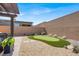 Low-maintenance backyard boasts gravel, desert plants, and a putting green at 10904 Ellis Pointe Ave, Las Vegas, NV 89166