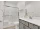 Bathroom with a walk-in shower featuring a glass door, a stylish vanity and modern fixtures at 10904 Ellis Pointe Ave, Las Vegas, NV 89166
