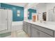 Modern bathroom features a double vanity, soaking tub, and glass-enclosed shower at 10904 Ellis Pointe Ave, Las Vegas, NV 89166