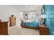 Comfortable bedroom with carpet flooring, dresser, and large window at 10904 Ellis Pointe Ave, Las Vegas, NV 89166