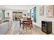 Dining room features a wooden table, seating for four, and patio access at 10904 Ellis Pointe Ave, Las Vegas, NV 89166