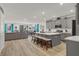This open kitchen boasts a large center island, stainless steel appliances, and gray cabinetry, perfect for modern living at 10904 Ellis Pointe Ave, Las Vegas, NV 89166