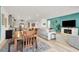 Open-concept living room with modern decor, fireplace, and dining area at 10904 Ellis Pointe Ave, Las Vegas, NV 89166