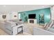 Spacious living room with comfortable seating, a fireplace, and stylish decor at 10904 Ellis Pointe Ave, Las Vegas, NV 89166