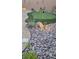 Backyard putting green with night lighting and rock landscaping at 10904 Ellis Pointe Ave, Las Vegas, NV 89166