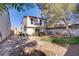 A backyard with a patio is shaded by a tree at 117 Lotus Blossom Ct, Las Vegas, NV 89145
