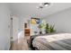 Serene bedroom featuring modern décor, a TV, and an ensuite bathroom at 117 Lotus Blossom Ct, Las Vegas, NV 89145