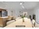 Dining area showcasing an open floorplan, an island, and a fireplace. (Virtually Staged) at 117 Lotus Blossom Ct, Las Vegas, NV 89145